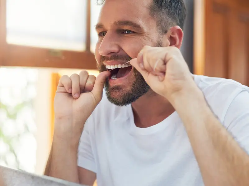 Man flossing